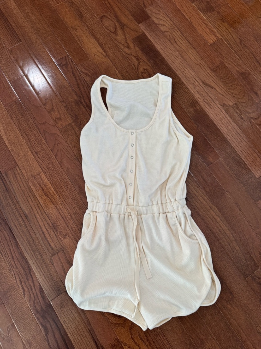 Cream Sleeveless Romper with Snap Front